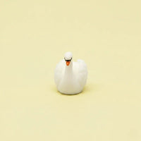 Miniature Swan Assorted (1Pc) on a light cream background.