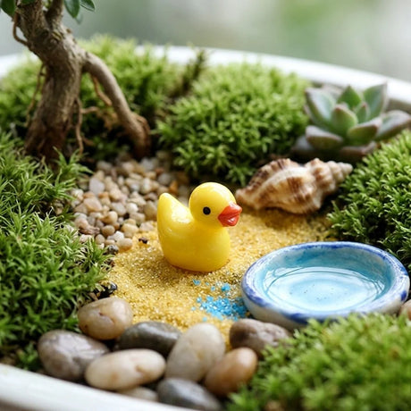 Miniature Resin Mini Duck (1pc) in the garden .