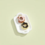 Miniature Dollhouse Doughnuts on the white background.