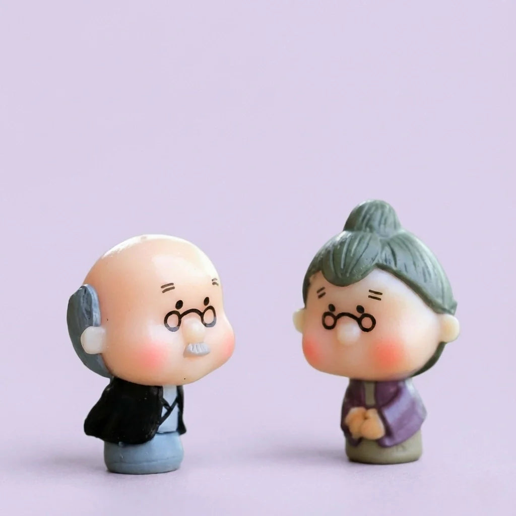 Miniature Old Couple Grandparents Assorted (Small) displayed on a purple background