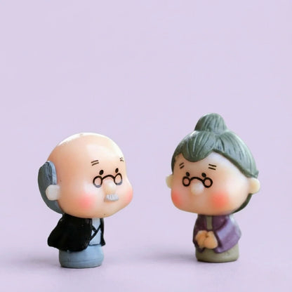 Miniature Old Couple Grandparents Assorted (Small) displayed on a purple background
