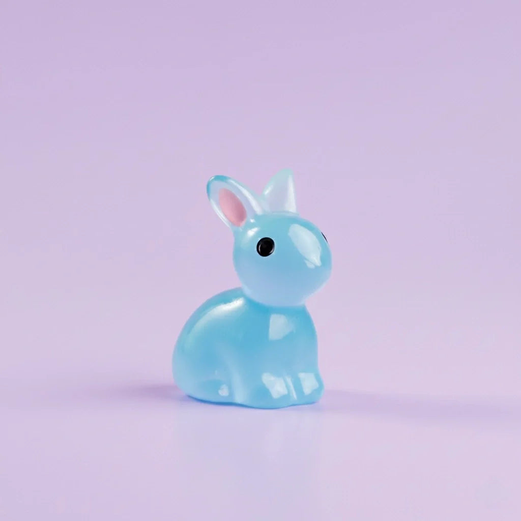 Miniature Glow Rabbit(1pc) on purple background.