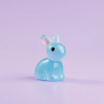 Miniature Glow Rabbit(1pc) on purple background.