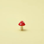 Miniature Garden Mushroom (1Pc) on the beige background.