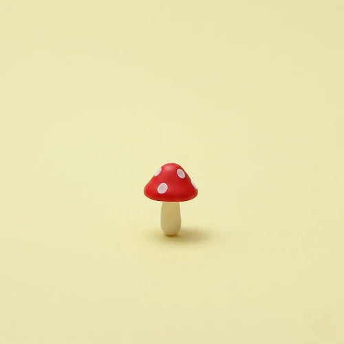 Miniature Garden Mushroom (1Pc) on the beige background.