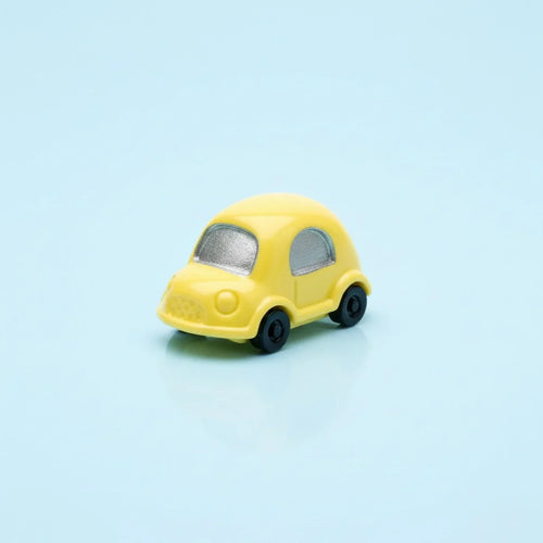Miniature Toy Car figure on the light pastel background.