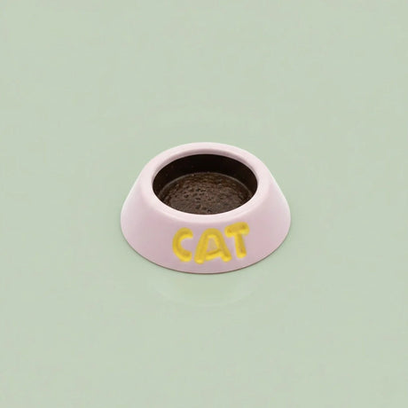 Miniature Cat Feeder (1pc) on the green background.