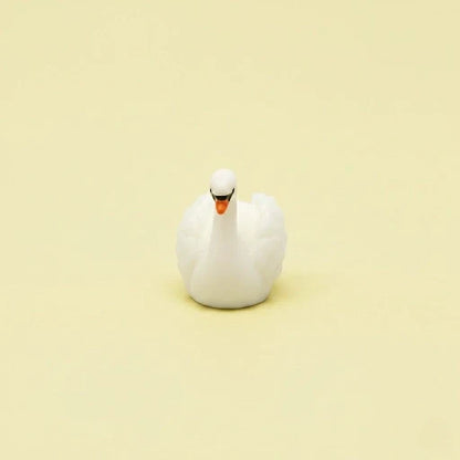 Miniature Swan Assorted (1Pc) on a light cream background.