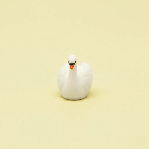 Miniature Swan Assorted (1Pc) on a light cream background.
