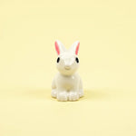 Miniature Rabbits Assorted (1Pc) on a pale yellow background.