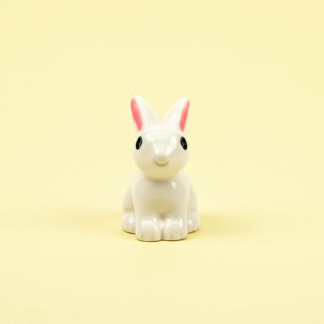 Miniature Rabbits Assorted (1Pc) on a pale yellow background.