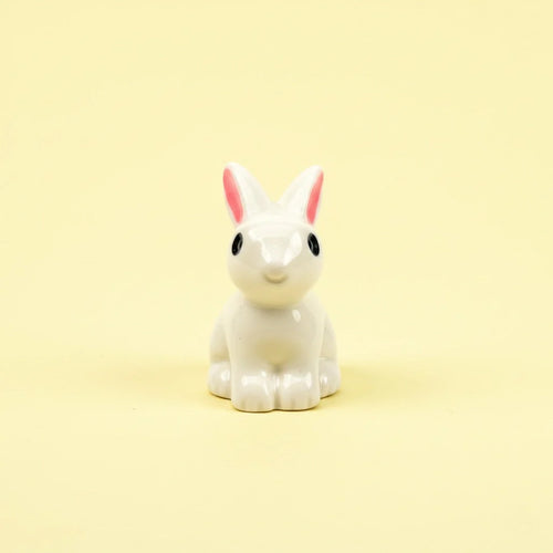 Miniature Rabbits Assorted (1Pc) on a pale yellow background.