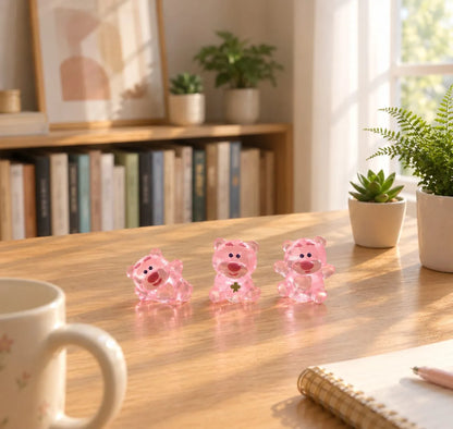 Miniature Glow Pink Bear Assorted (1pc) displayed on a wooden table with other miniatures