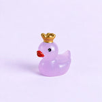 Miniature Glow Crown Duck Assorted (1pc) displayed on a light purple background