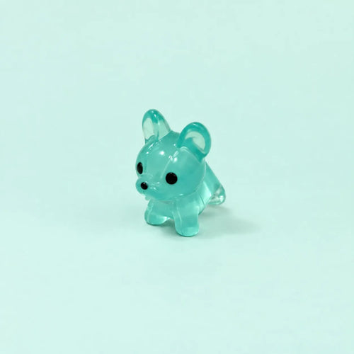 Miniature Glow Mini Dogs Assorted (1pc) displayed on a mint green background