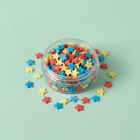Miniature Polymer Clay Stars Assorted (10Pcs) on a light mint green background.
