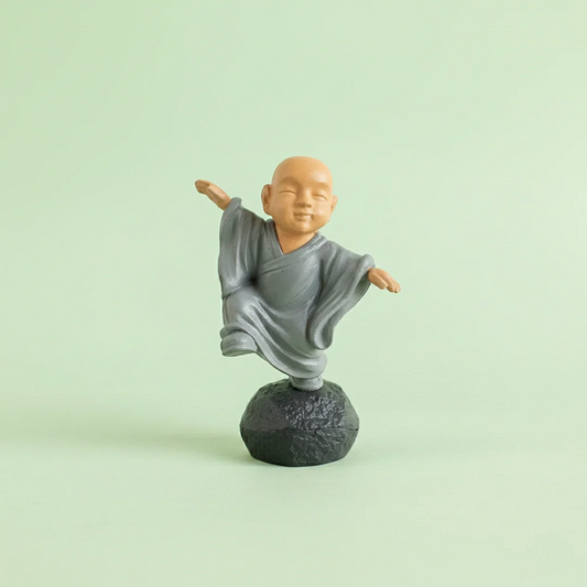 Miniature Chinese Feng Shui Monks Assorted (1pc) displayed on a light green background
