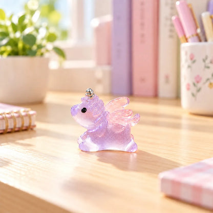 Miniature Glow Unicorn Horse Assorted (1pc) displayed on a desk near a window with decorative items
