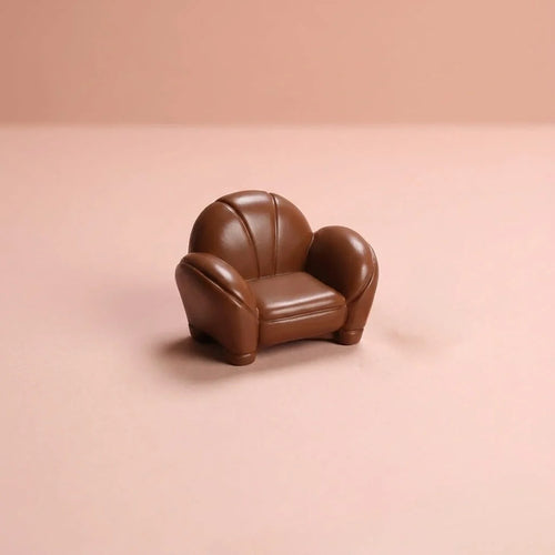 Miniature Leather Sofa Assorted (1pc) displayed on a pink background