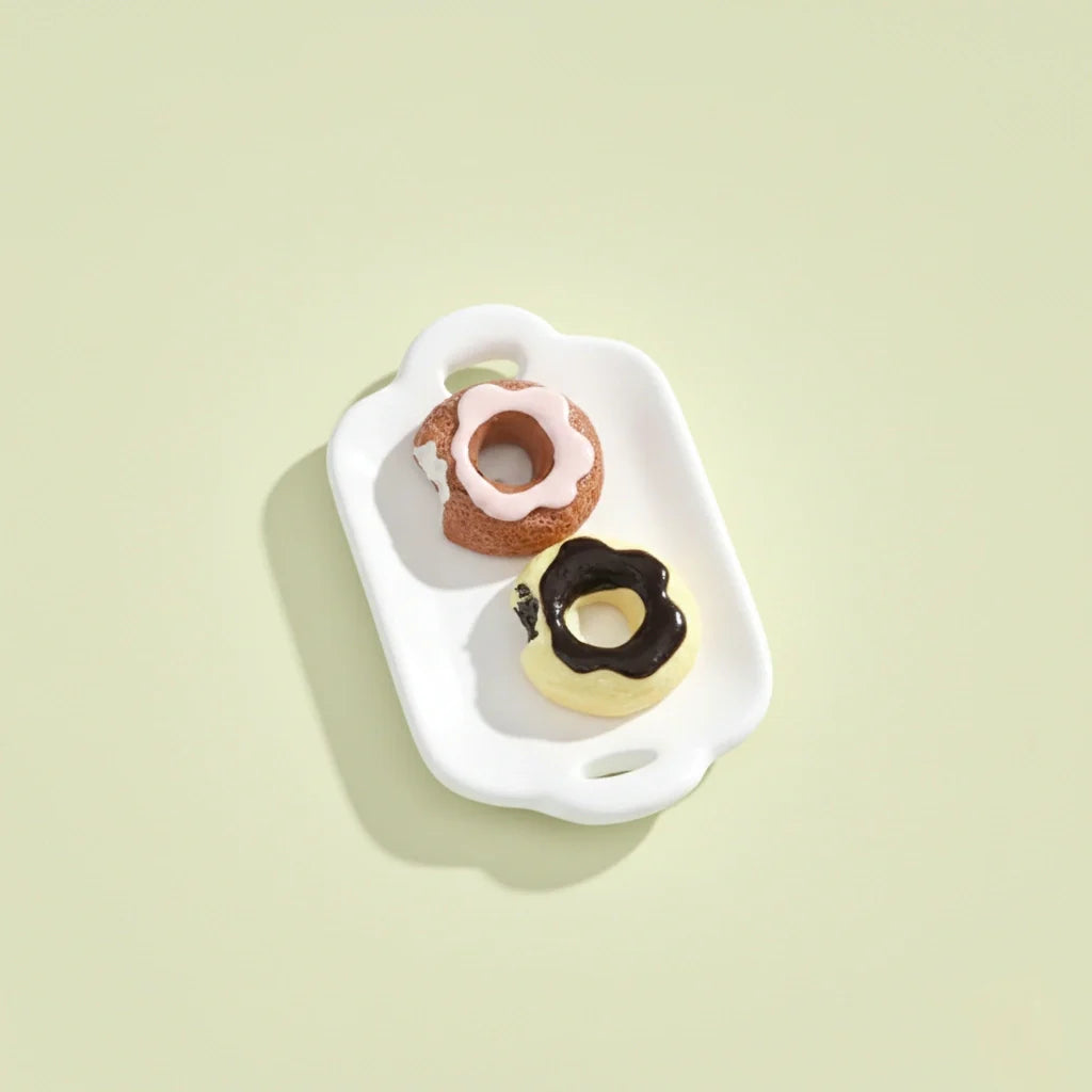 Miniature Dollhouse Doughnuts on the white background.