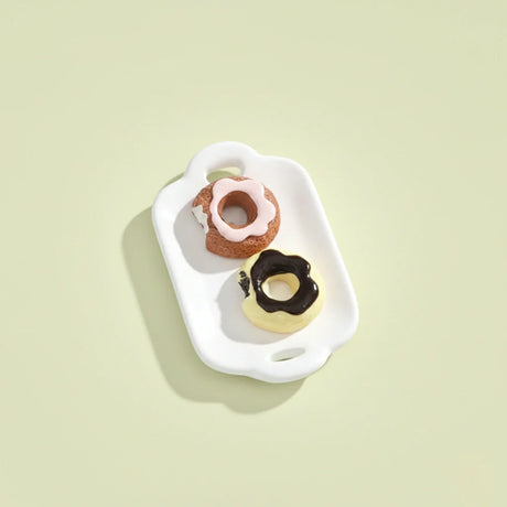 Miniature Dollhouse Doughnuts on the white background.