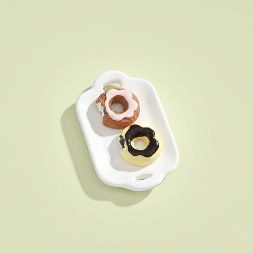 Miniature Dollhouse Doughnuts on the white background.