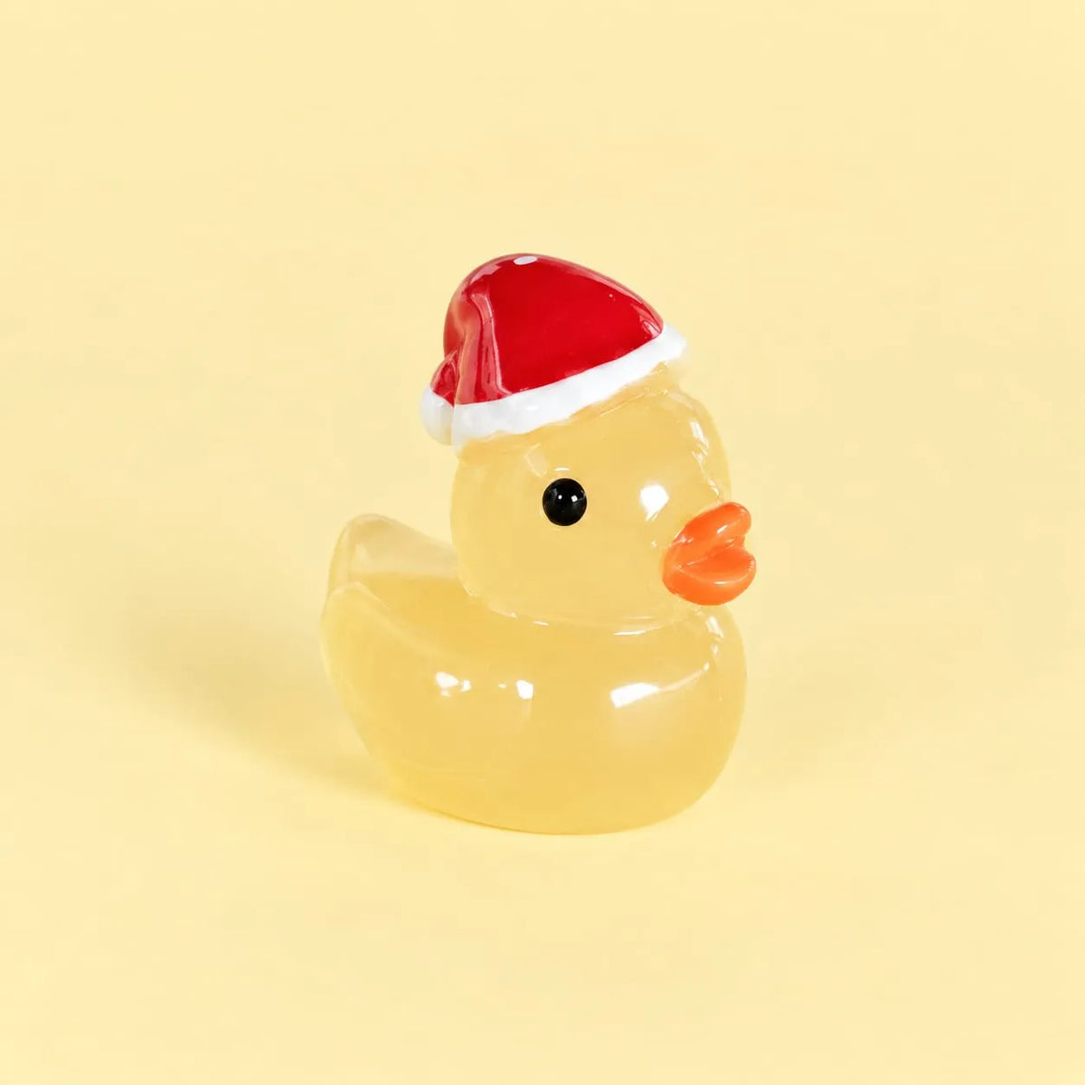 Miniature Glow Christmas Hat Duck Assorted (1pc) displayed on a light yellow background