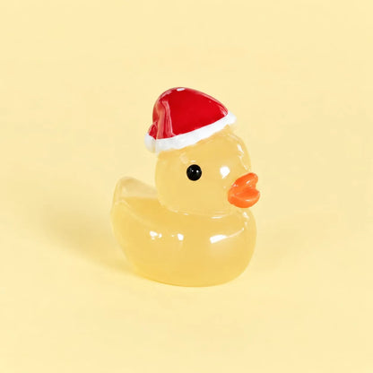 Miniature Glow Christmas Hat Duck Assorted (1pc) displayed on a light yellow background