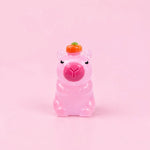 Miniature Glow Cute Pig Assorted (1pc) displayed on a pink background
