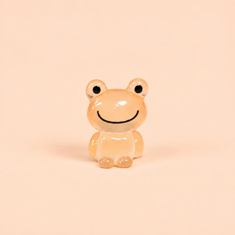 Miniature Glow Frog Assorted (1pc) displayed on a peach background