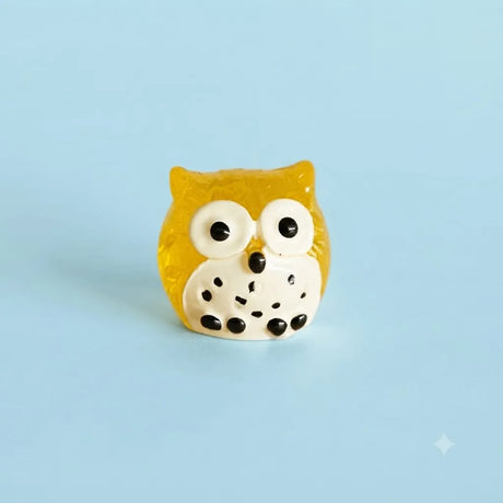 Miniature Glow Owl Assorted (1pc) displayed on a light blue background
