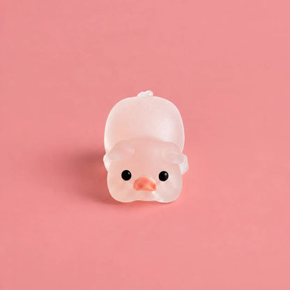 Miniature Glow Pink Yoga Pig Assorted (1pc) displayed on a pink background