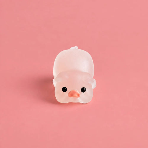 Miniature Glow Pink Yoga Pig Assorted (1pc) displayed on a pink background
