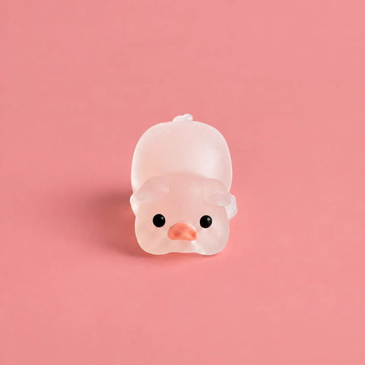 Miniature Glow Pink Yoga Pig Assorted (1pc) displayed on a pink background