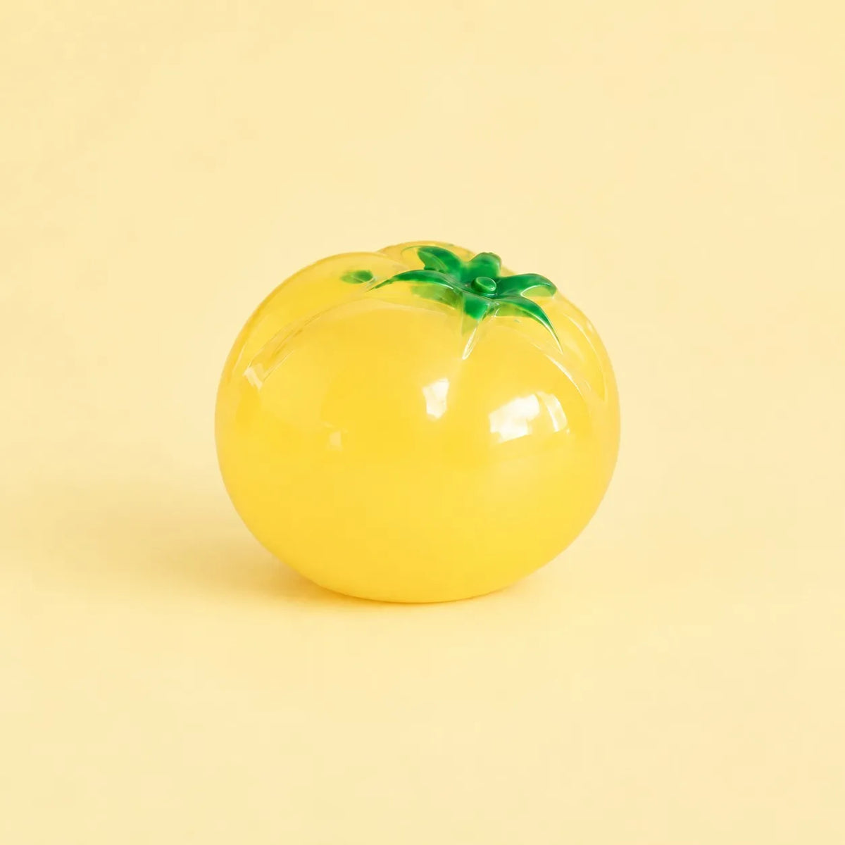 Miniature Glow Tomato Assorted (1pc) displayed on a light yellow background