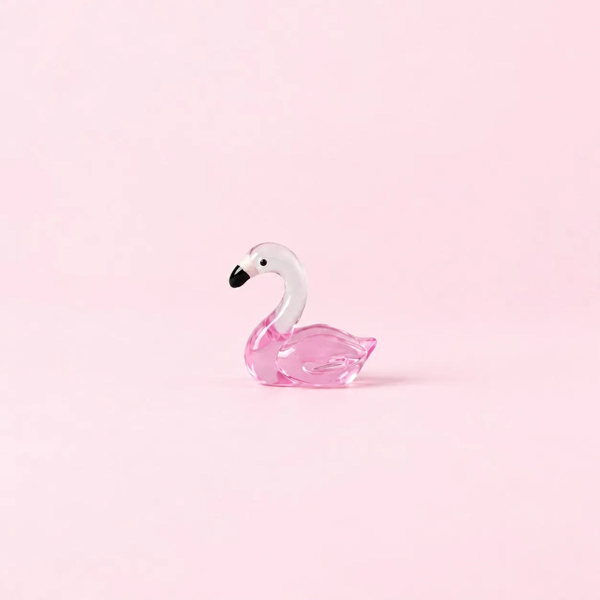 Miniature Glow Swan Assorted (1pc) displayed on a light pink background