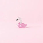Miniature Glow Swan Assorted (1pc) displayed on a light pink background