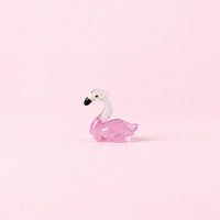 Miniature Glow Swan Assorted (1pc) displayed on a light pink background